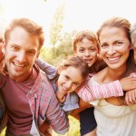 Multi-generation family having fun together outdoors