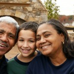 Minority couple with their grandson at their home